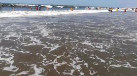 Boys Facing Big Waves In Ras El Bar Beach