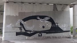 Mural under a bridge by Blasto + Acaro