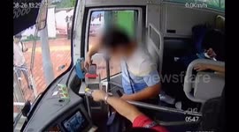Chinese man inserts phone into cash box attempting to pay for bus fare