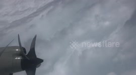 Incredible aerial view of the 'stadium effect' inside Hurricane Dorian
