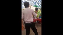 The man used his tongue to block the running engine fan at high speed
