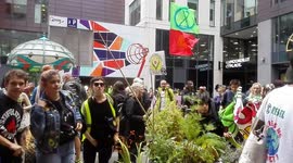 'Power to the people!' Extinction Rebellion protesters gather outside Barclays office in Manchester