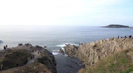 Tojinbo Cliffs with boats in Fukui, Japan.