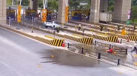 Car flips 360 degrees after smashing into toll gate in China's Yiwu
