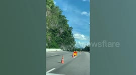 Thai driver captures the moment landslide smashes into road