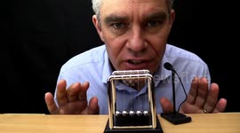 Science teacher experiments with a Newton's Cradle and the results might put you to sleep ... in a good way