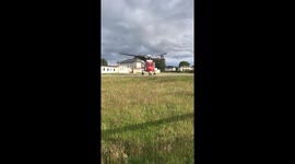 Irish Coast Guard rescue helicopter taking off from hospital