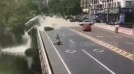 Truck falls off bridge after avoiding three-wheeler in China's Wenzhou