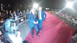 Iggy Pop stumbles as he leaves the GQ Awards in London