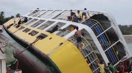 Terrified passengers climb to safety after ferry capsizes in the Philippines