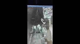 Dog urinates on Filipino teenager too busy playing on mobile phone to move