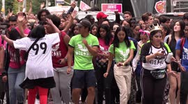 Thousands of university and college students in Toronto parade through the streets during frosh week celebrations near campus