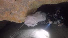 Scuba divers find huge sheet of plastic floating in cave system off the Bahamas