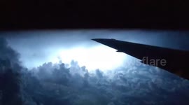 Spectacular lightning storm captured from plane window flying over US