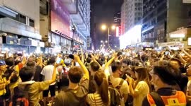 Hong Kong protesters singing outside police station