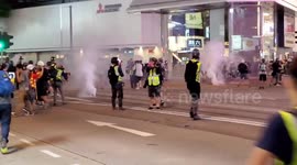Hong Kong police fire tear gas in busy shopping district
