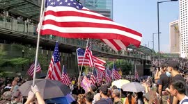 Hong Kong Protesters chant USA, USA while marching to the US Consulate