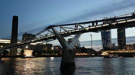 Hyperlapse of the Millennium Bridge after sunset and the Ship of Tolerance art installation.