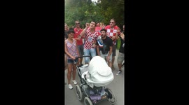 Hilarious scene as Croatian football fans sing random Slovakian baby a lullaby