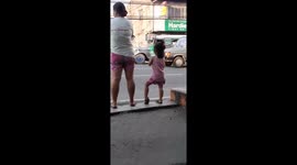 Girl Dances While Waiting For The Bus