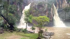 Waterfall floods after heavy monsoon rainstorms in Thailand