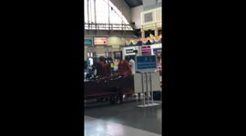 Buddhist monk tears off his robes to fight man who accused him of being a fake