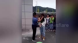 Teacher uses towel to wipe off students' makeup at school gate in China