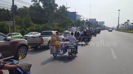 Wedding guests travel to ceremony in huge convoy of motorcycle side trailers