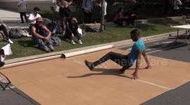 Students at the university of Toronto show off their break dancing skills on a hot sunny September day on campus