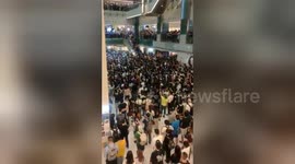 Hundreds gather to sing protest 'anthem' at Hong Kong shopping mall