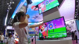 Visitors test official video game of Tokyo 2020 Olympics at Japanese gaming event