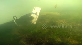 US scuba diver retrieves woman's phone after she dropped it into a river