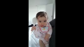 10 month old baby brushes her hair before bed