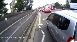 UK cyclist nearly hit after car dangerously drives into bike lane
