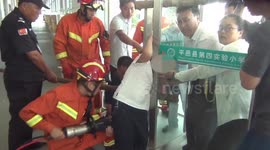 Chinese firemen free six-year-old boy's head from glass doors