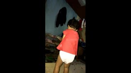 a little girl in the field sways to follow disco music