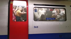 Just another morning on the London underground: Commuters packed in like sardines on the Piccadilly Line