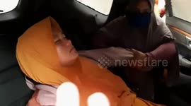 Woman faints from smoke exposure during haze crisis in Indonesia