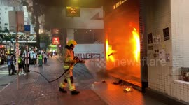 Firefighters put out blaze lit by Hong Kong protesters at Wan Chai station