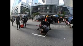 Protesters in Hong Kong advance their barricades near to the police HQ