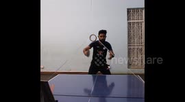 Unreal 360 blind ping pong trick shot through a suspended tape