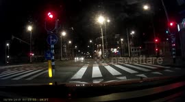 You never know when you'll get rear-ended: pedestrian moons car driver at stoplight.