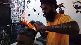 Lit! South Indian barber sets customers' hair aflame for fire social media posts