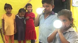 'This town is electric!' 12 residents of Indian village able to light up LED bulbs pressed against their skin