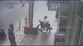 CCTV footage shows thief snatching phone from disabled man's hands in Indonesia