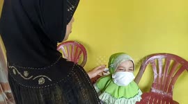 Kindergarten students in Indonesia wear protective masks after government declare air quality unhealthy