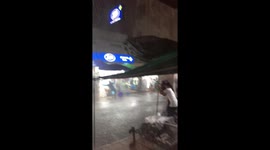 Storm rips through street market in Bangkok as people run for cover