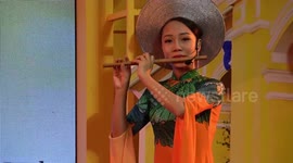 Vietnamese dancers perform traditional music show in colourful costumes