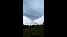 Villagers awestruck by mothership cloud hovering above their homes