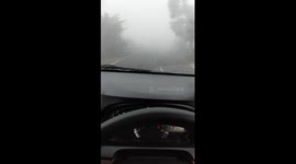 haze blankets the highway traffic in the province of West Sumatra